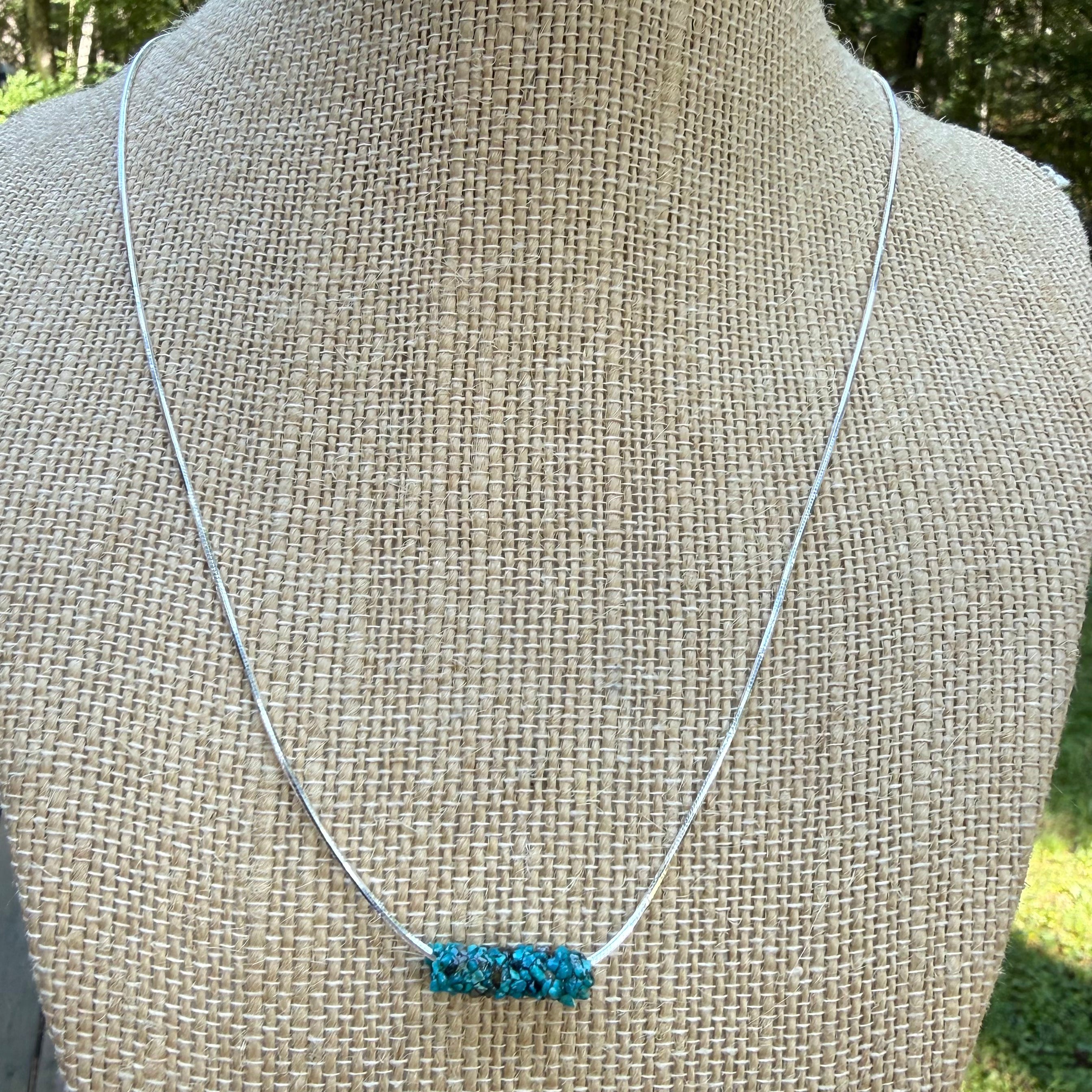 Natural Caddisfly Case Necklace on a 18" Sterling silver snake chain.