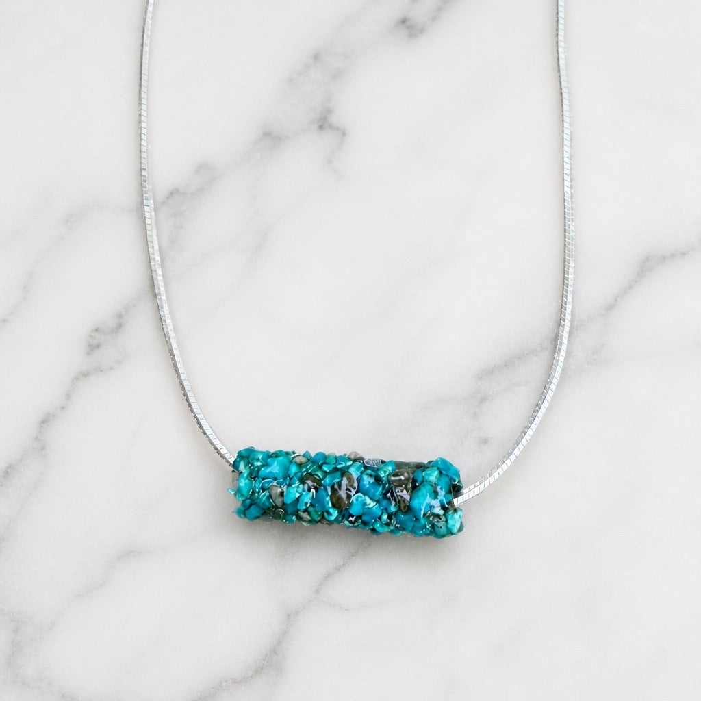 Natural Caddisfly Case Necklace on a 18" Sterling silver snake chain.