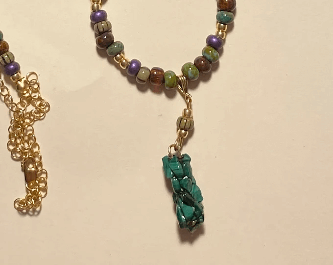 rainbow gemstone combination of a caddisfly necklace