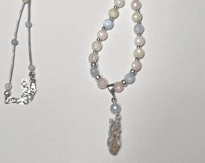 shiny white and opalescent sharp edged caddisfly necklace