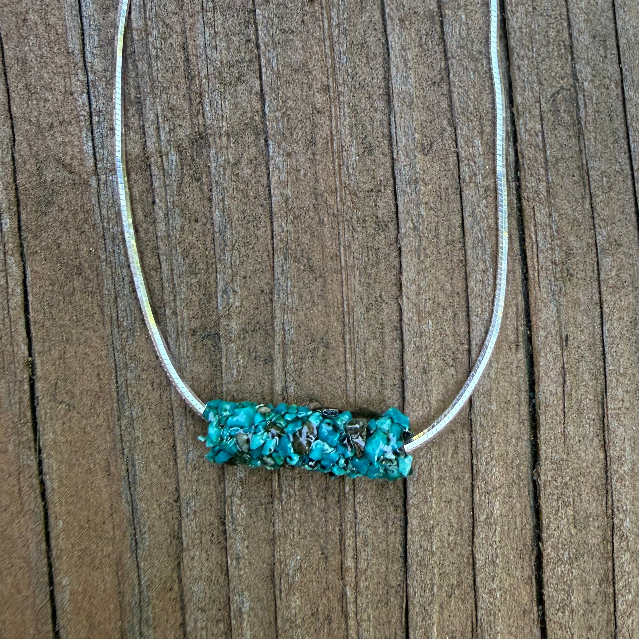 Natural Caddisfly Case Necklace on a 18" Sterling silver snake chain.
